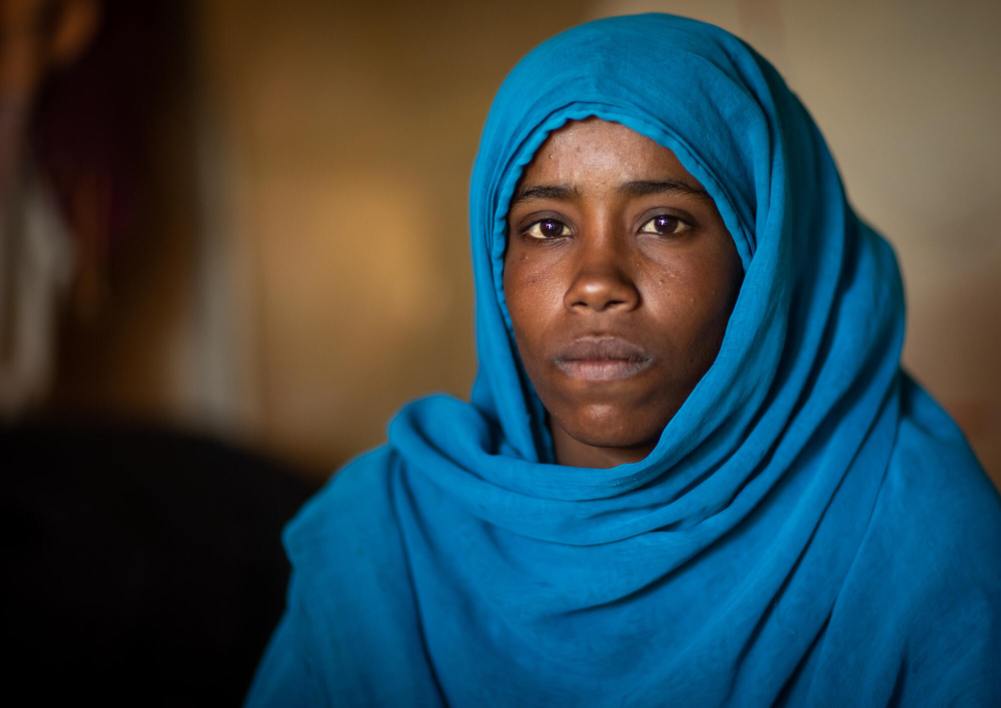 A woman from the Beja tribe woman in Port Sudan, the capital of the Red Sea State in eastern Sudan, poses for a portrait. 