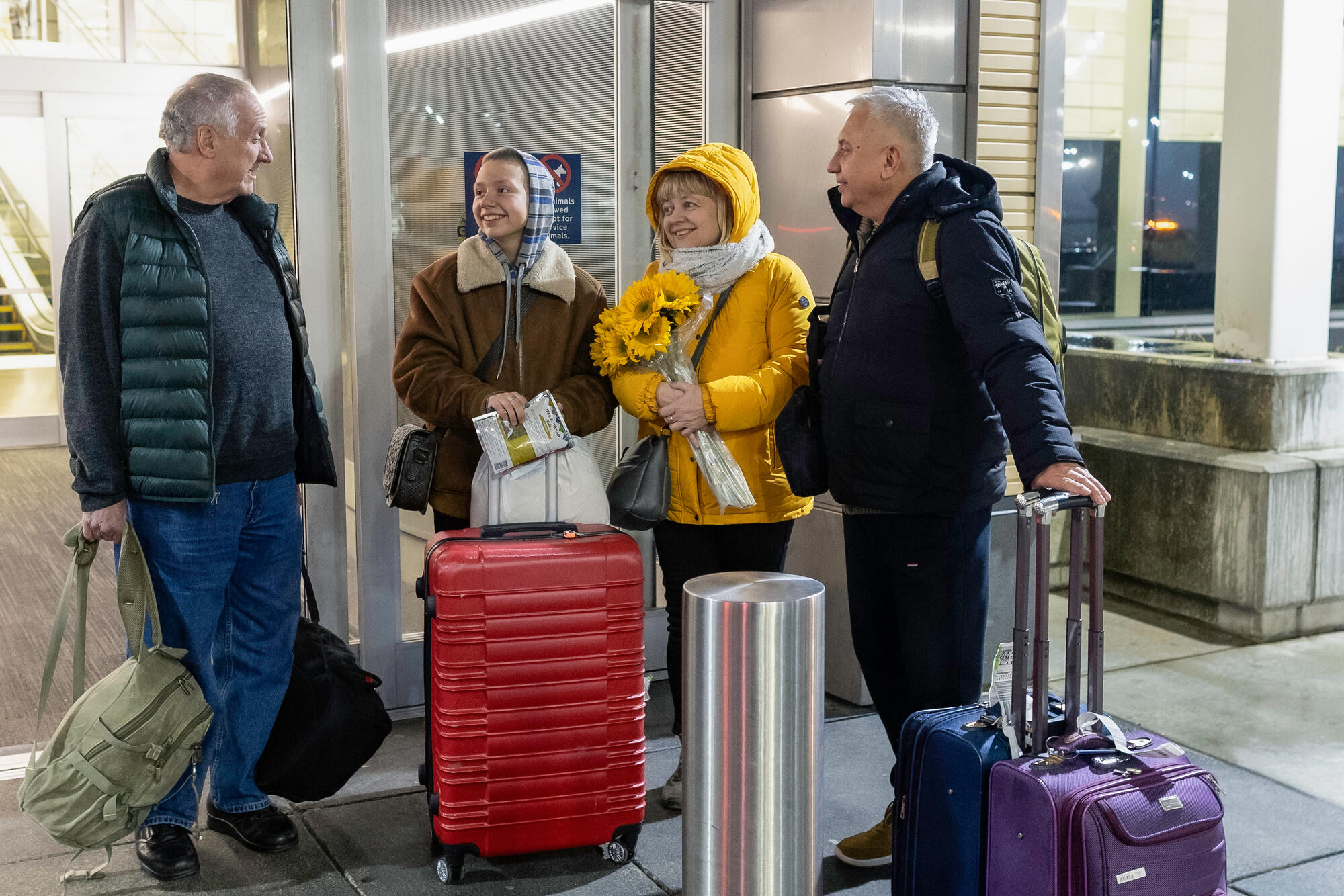 The Plegutsa family arrive at the airport in Kansas