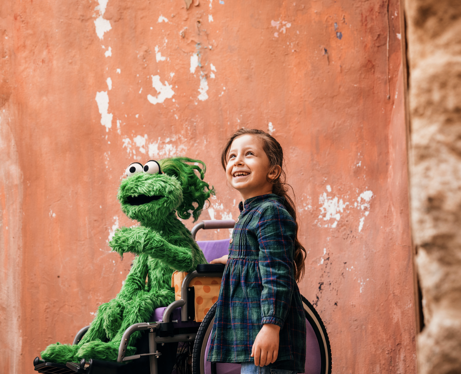 Ameera and a young child in Saida, Lebanon. Photo Credit: Ryan Heffernan/Sesame Workshop.