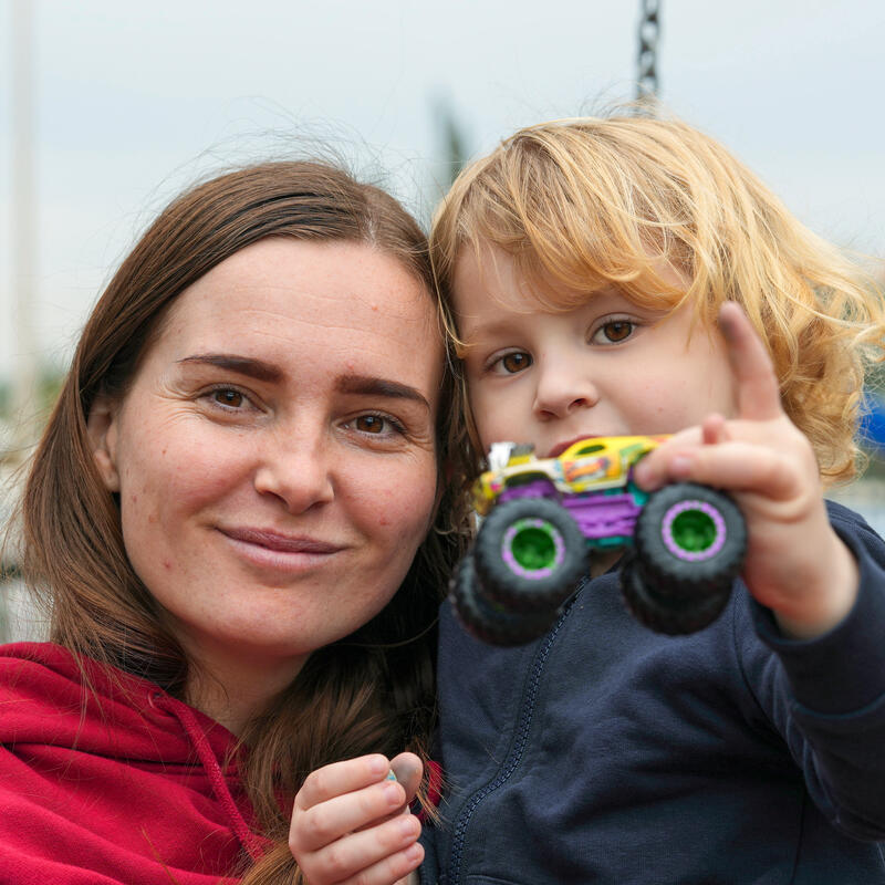 IRC client, Khrystyna, 32, with her son, Yaroslav, 4, in a park after picking up Yaroslav from preschool.