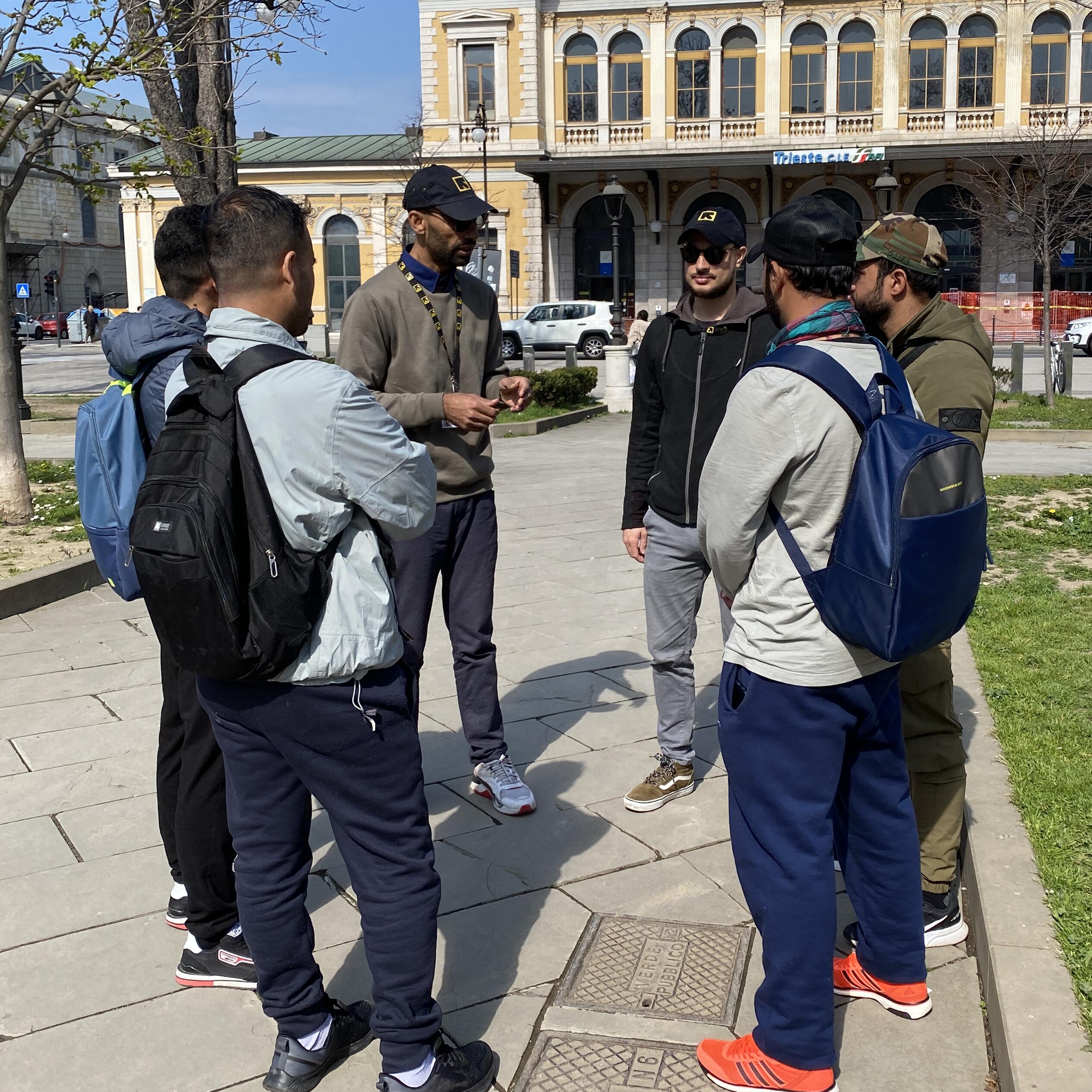 IRC staff provide information to young people at Trieste Central Station