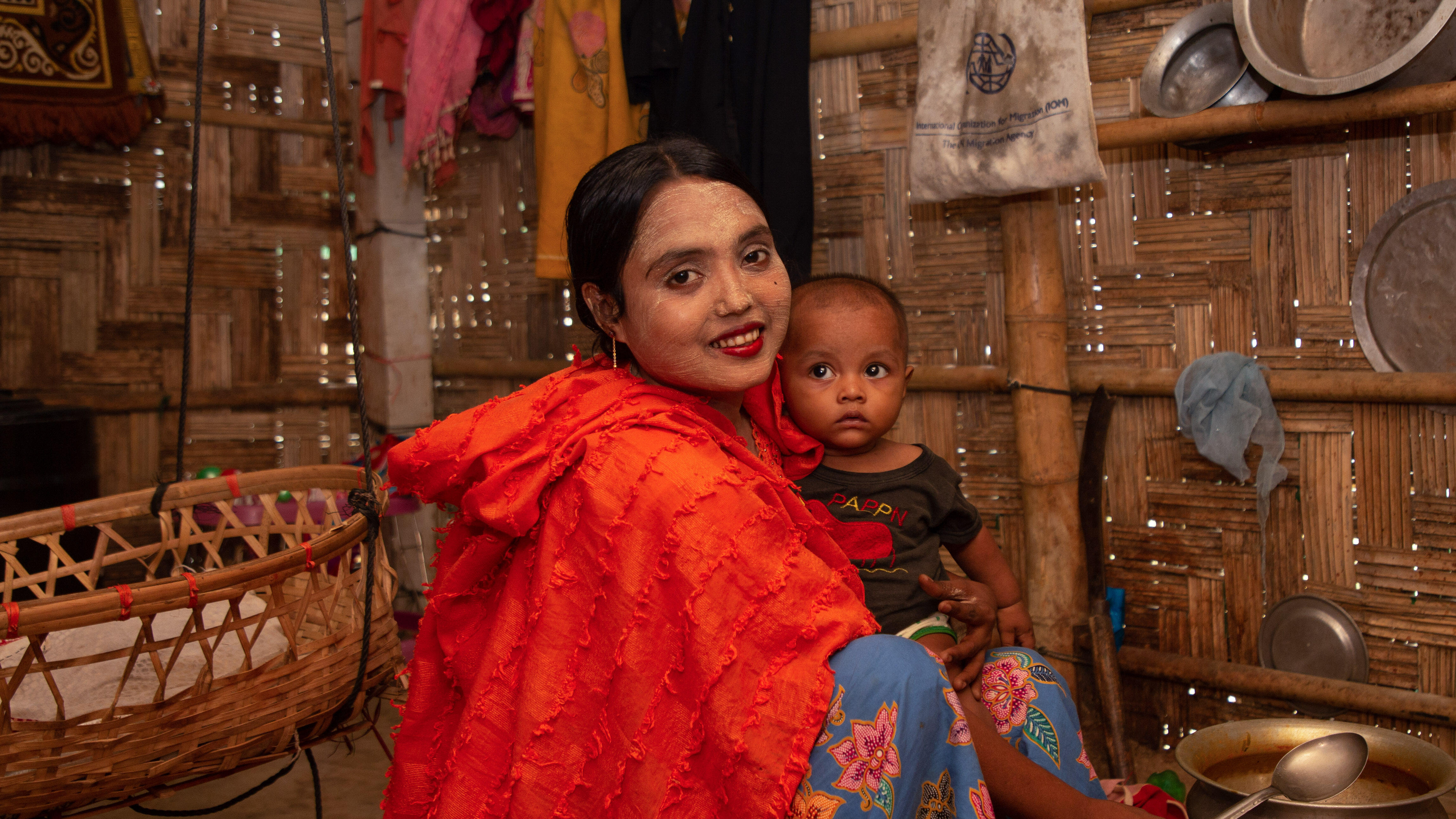 A woman and her child pose for a photo in Bangladesh.