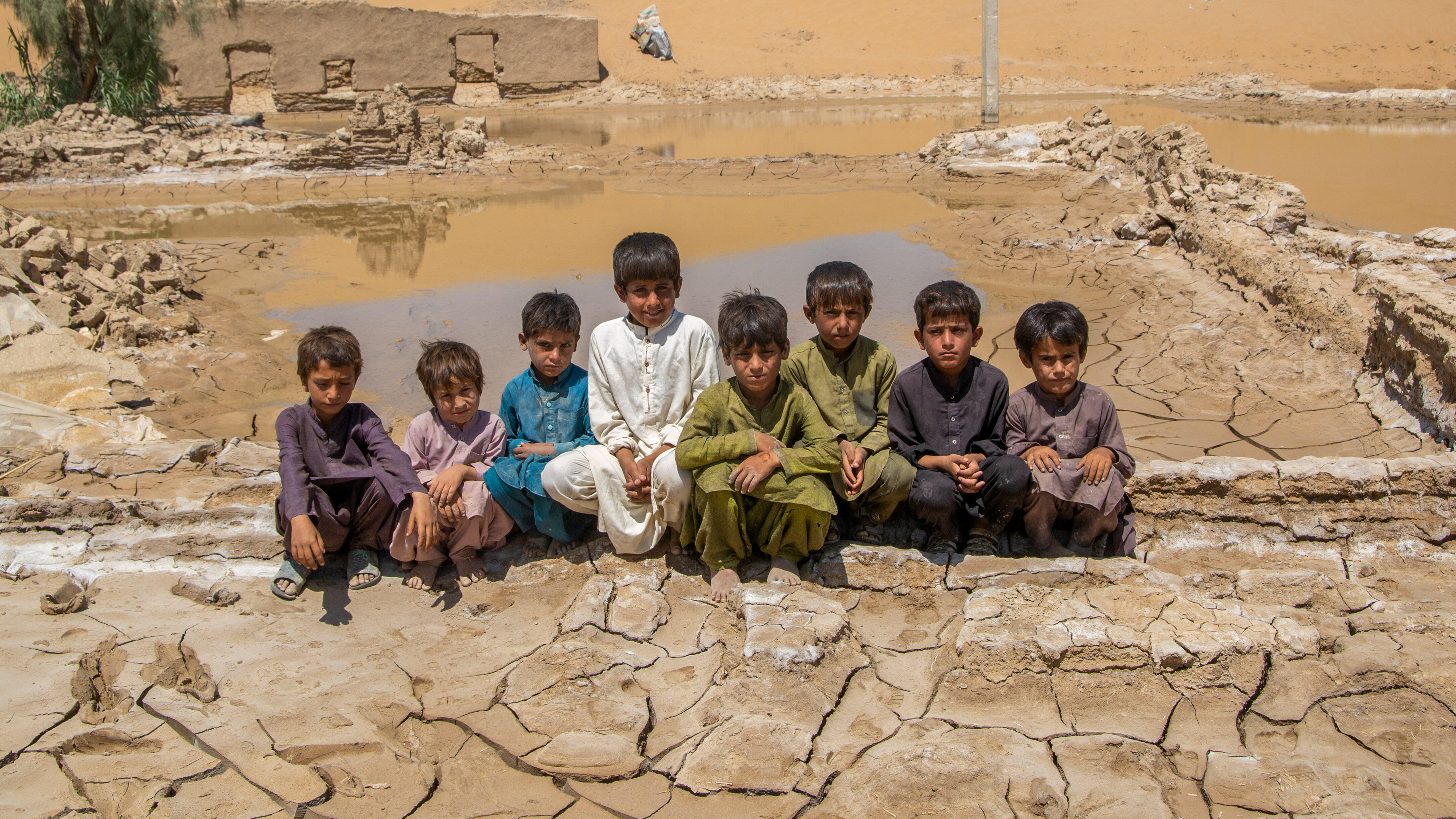 A group of boys sit together in Pakistan