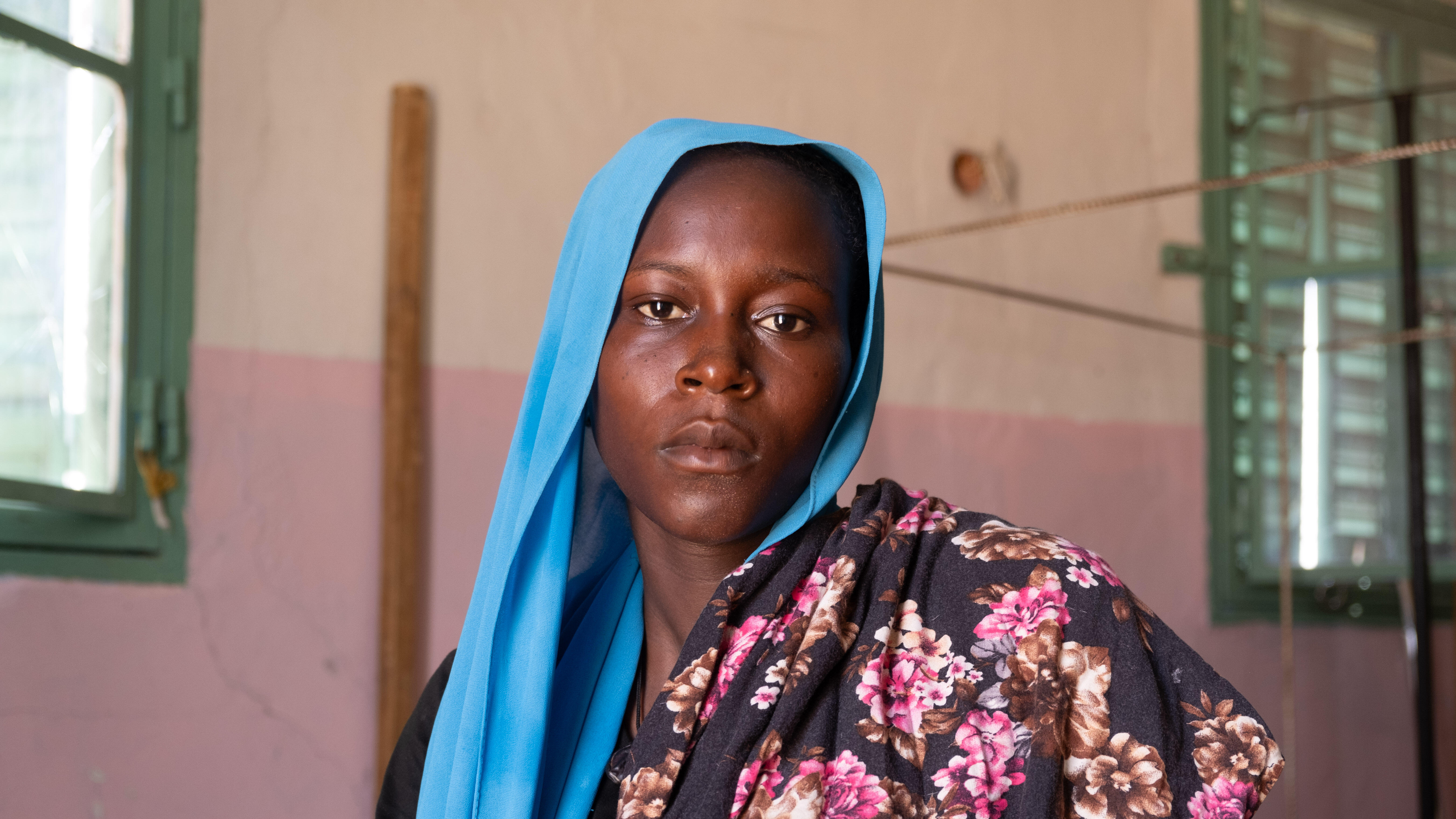 A women poses for a photo in a building in Chad.