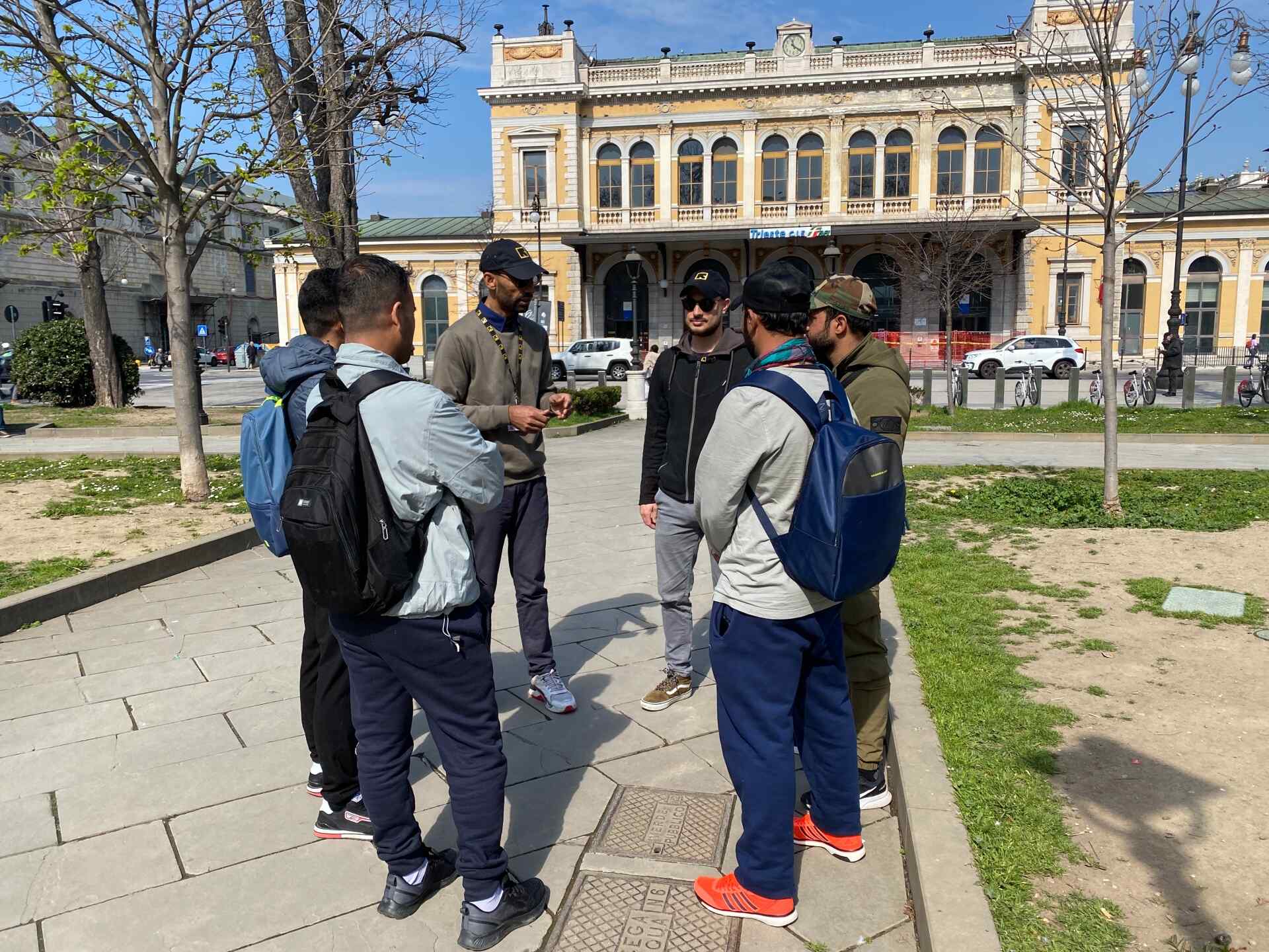 IRC staff provide information to young people at Trieste Central Station.