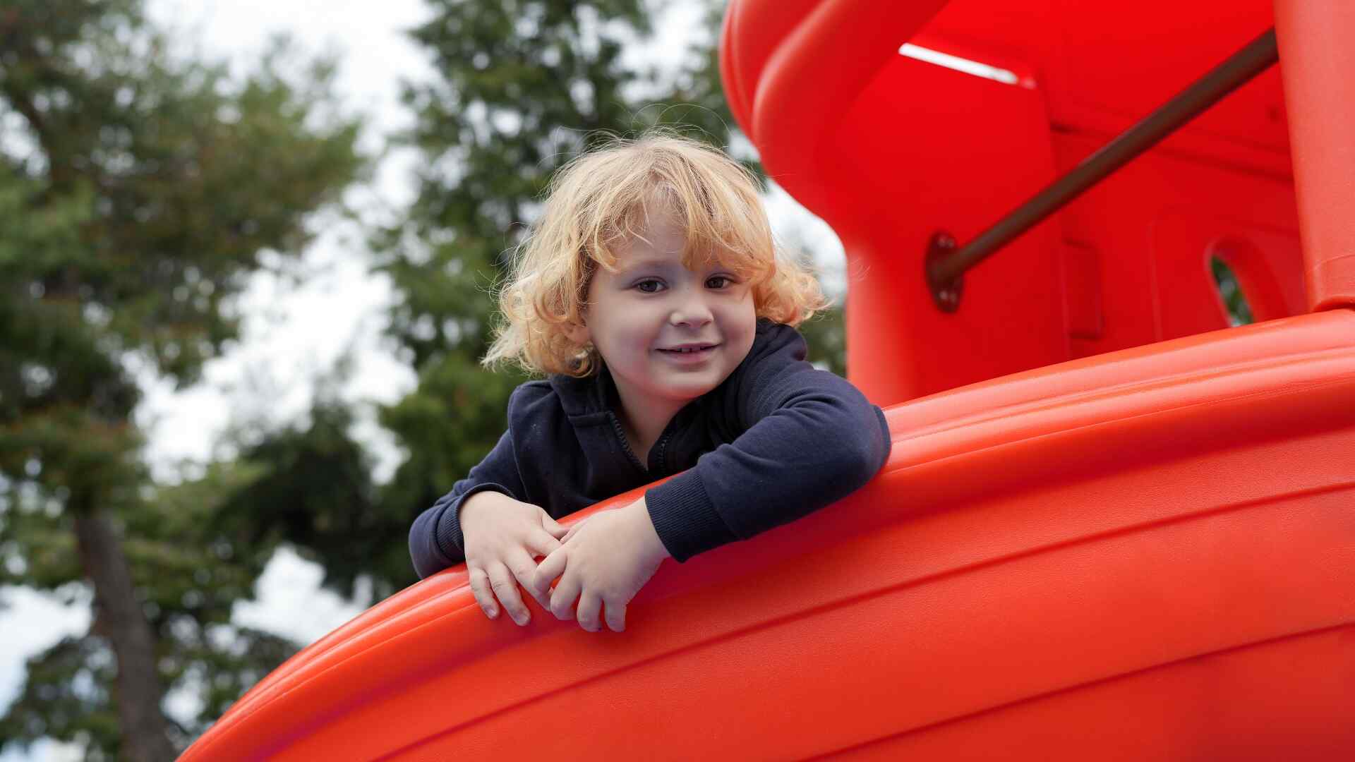 A young girl at a playground in Greece.