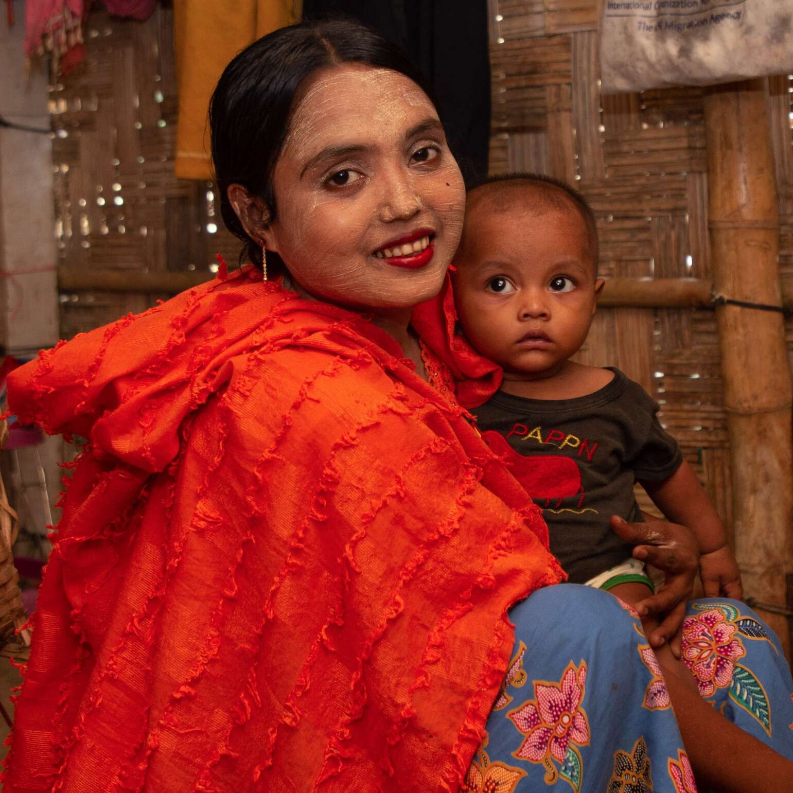 A woman and her child pose for a photo in Bangladesh.