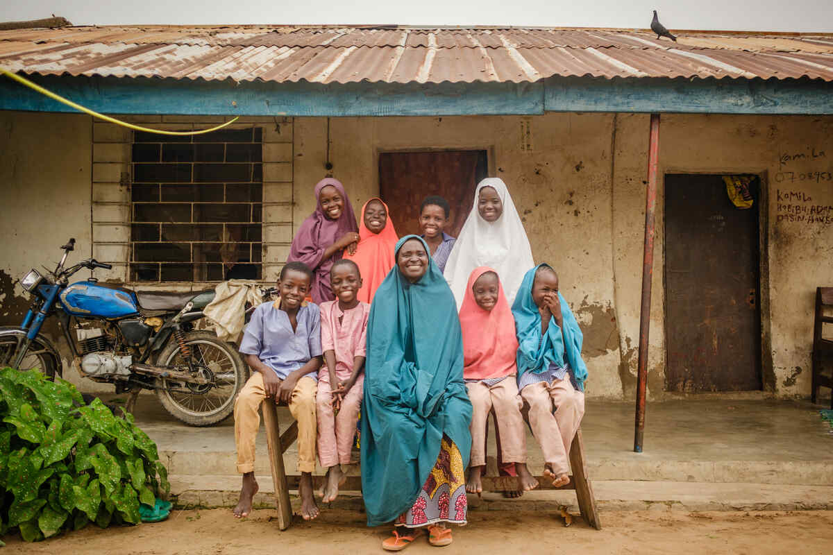 Portrait of Faiza Habibu(60) and her family in her home in Dasin Hausa community, Adamawa State Nigeria.