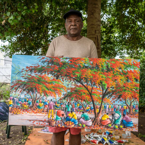 Muyambo Marcel Chishimba is a Congolese refugee resettled by the International Rescue Committee (IRC) in Elizabeth, New Jersey. As a young boy, he was taught to paint by his uncle, acclaimed Congolese artist Kabemba Albert Stounas.