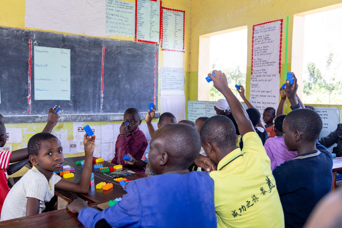 Students using LEGO at Itambabiniga Primary School.