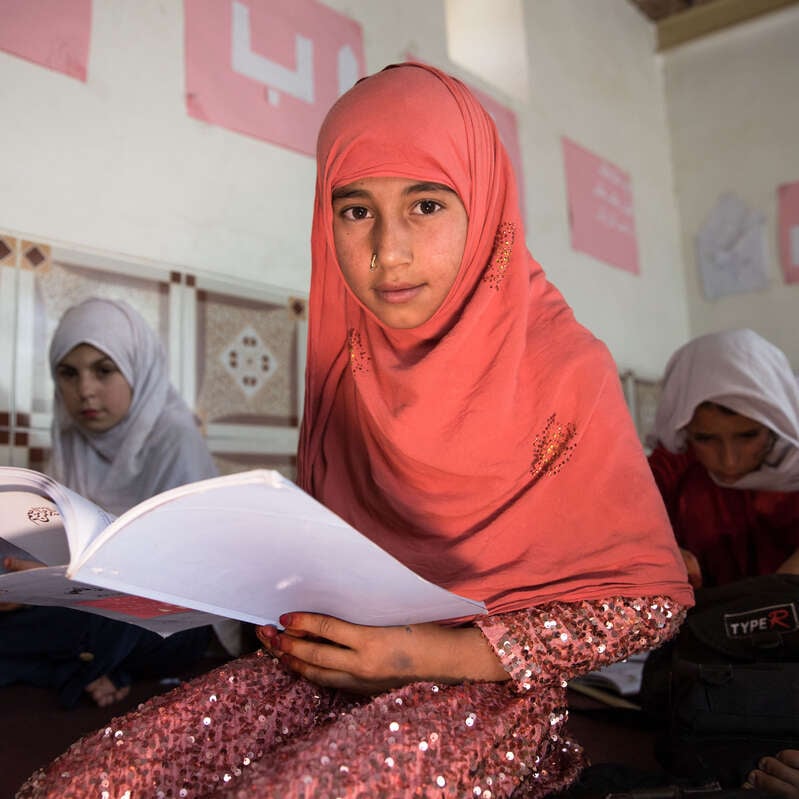 Through community-based programming, Lialoma, 8, receives education in Pul-e Alam, Afghanistan.