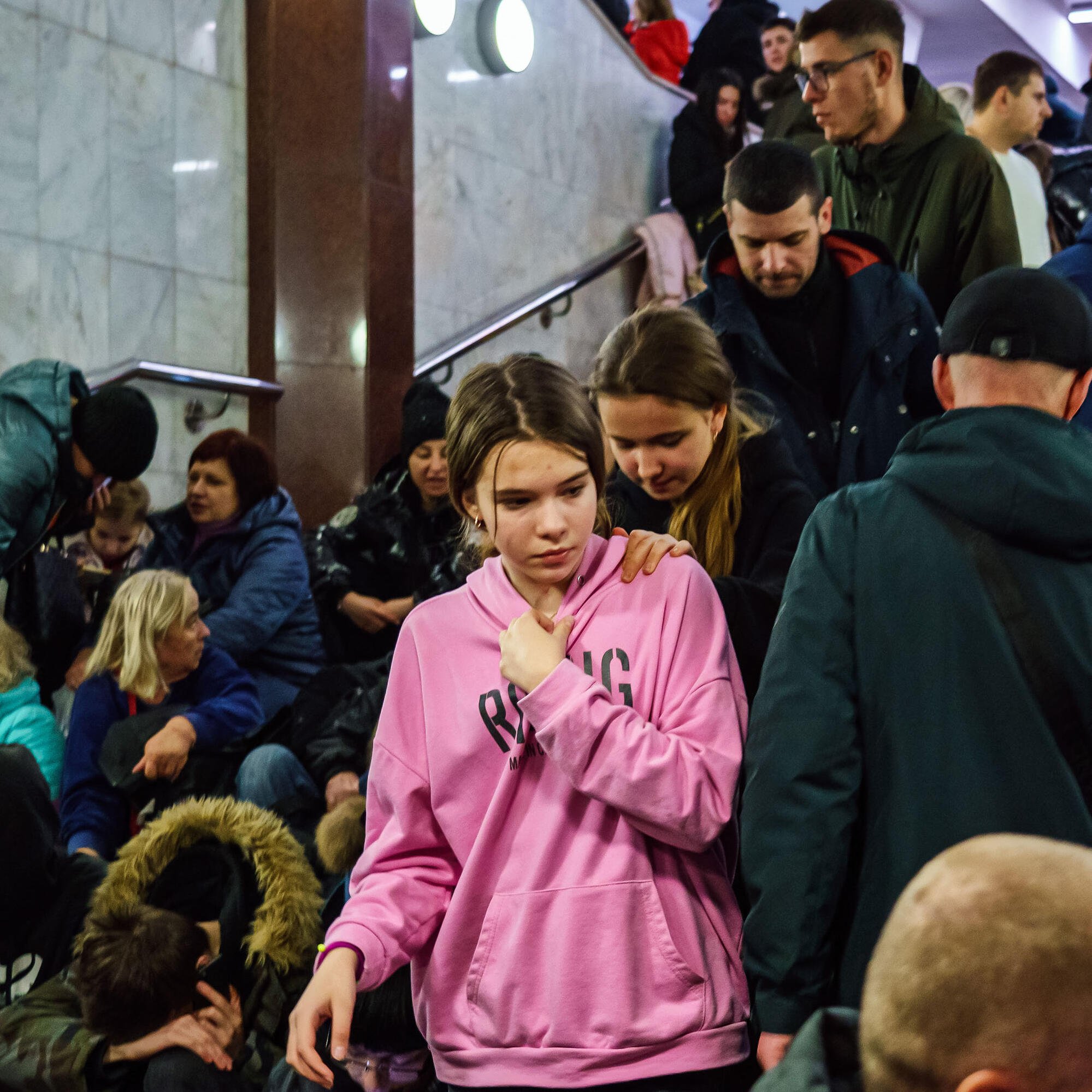 Hundreds of people seek shelter underground, on the platform, inside the dark train cars, and even in the emergency exits, in metro subway station as the Russian invasion of Ukraine continues, in Kharkiv, Ukraine.