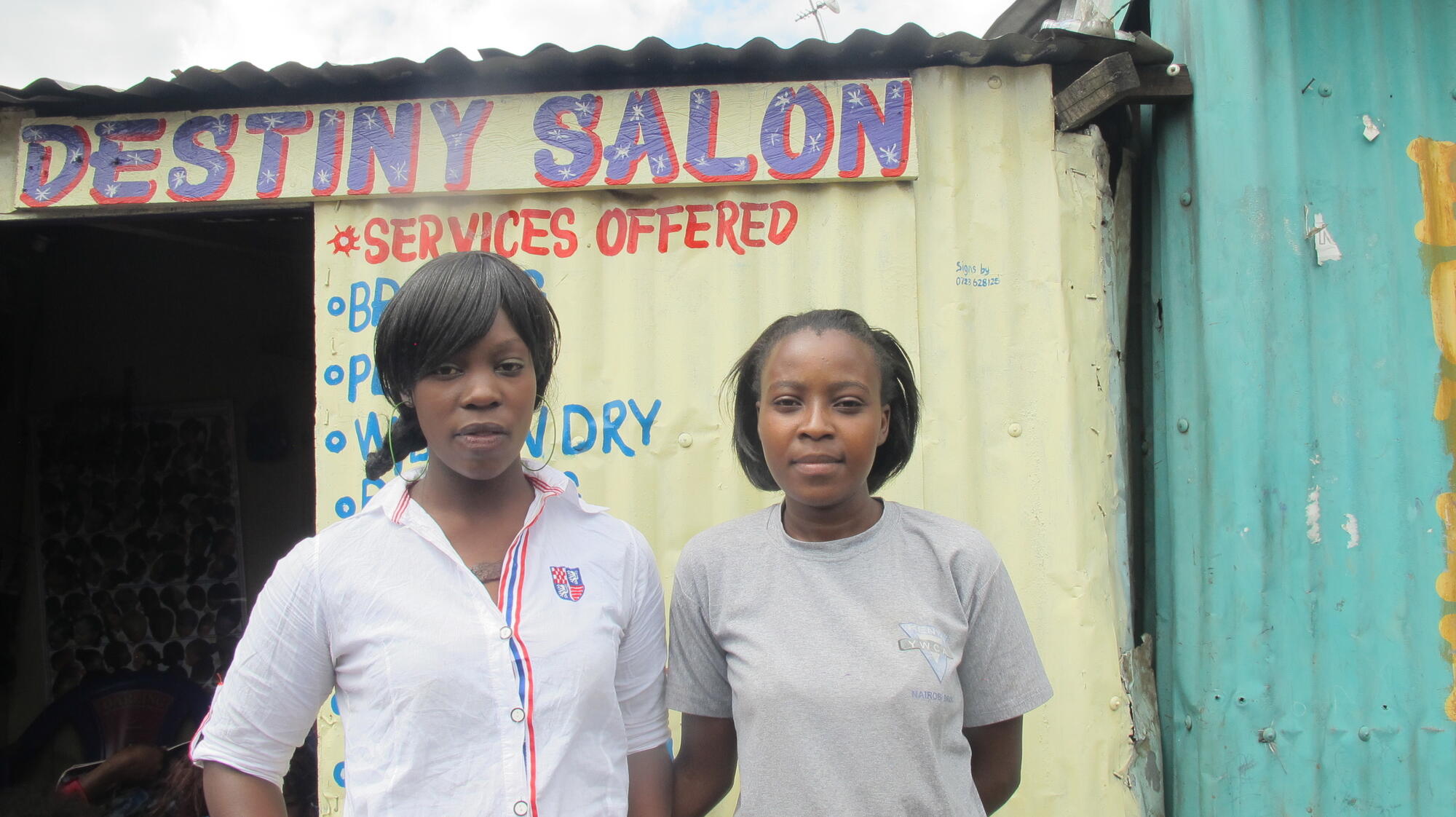 Susan and partner Mariam outside Nairobi salon