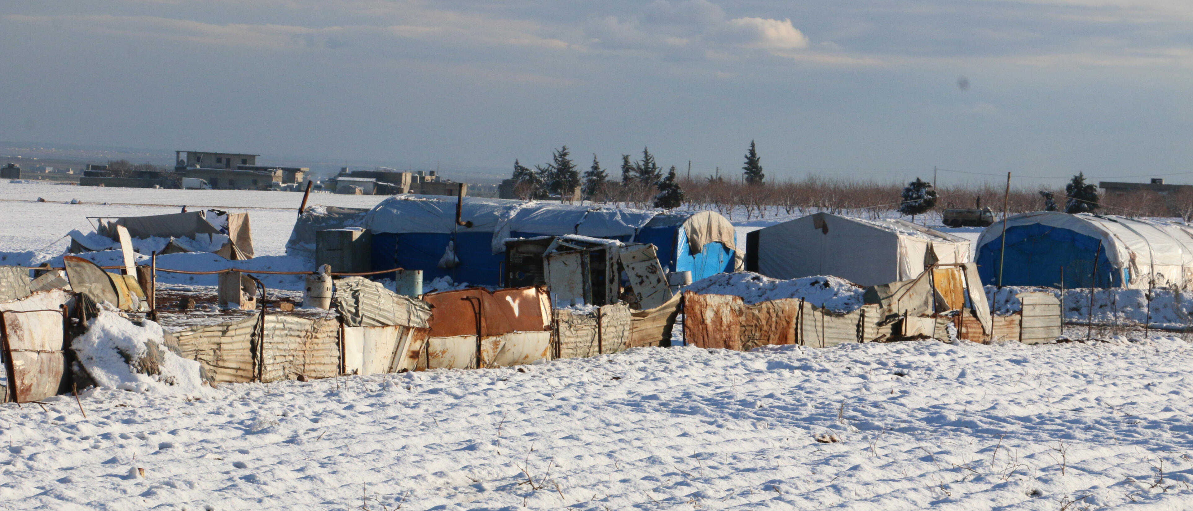 A line of tents in the snow