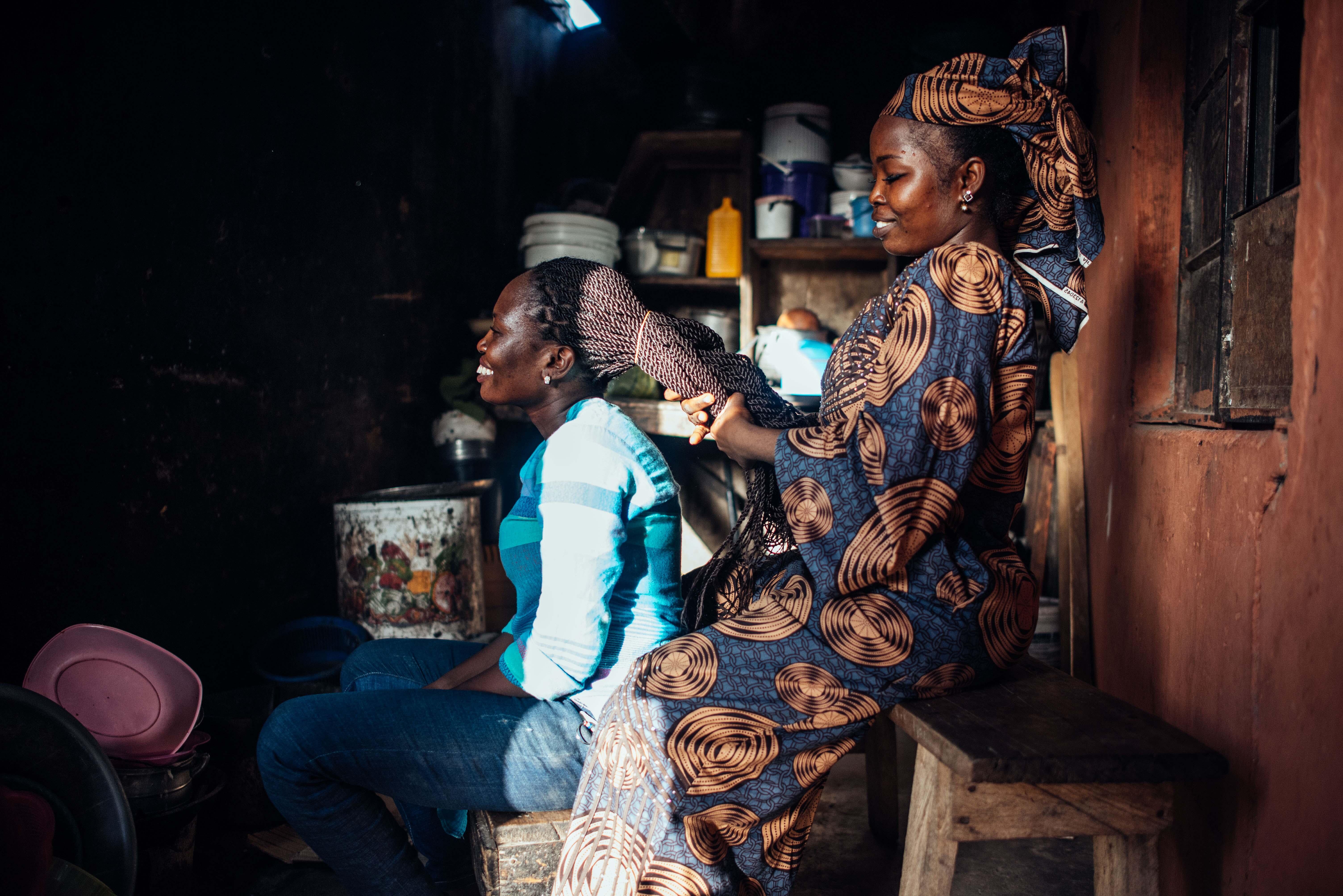 Hairdresser Abigail styles a customers hair.