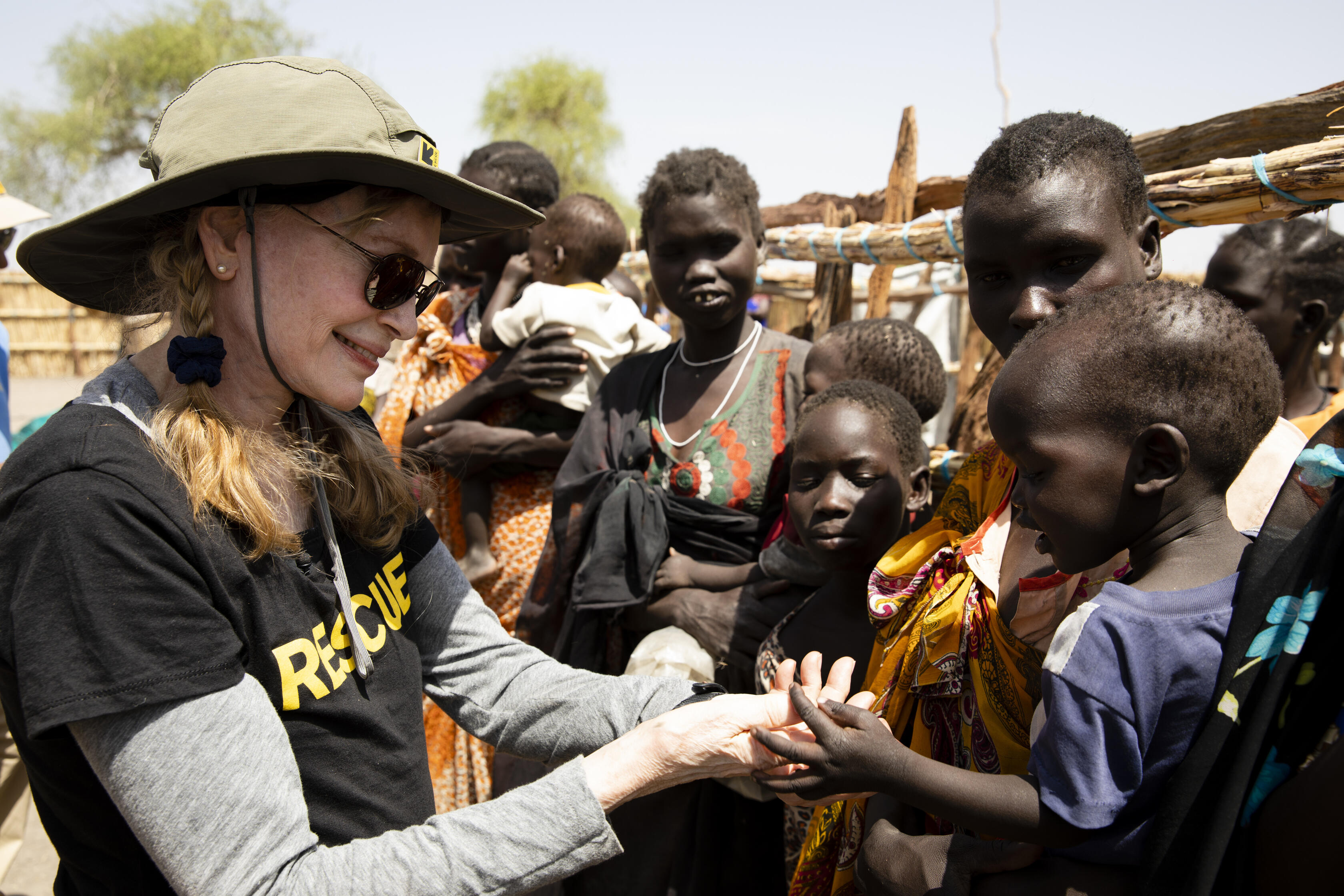 Mia Farrow with families in a village in in South Sudan with charity IRC