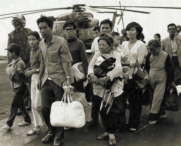 South Vietnamese refugees arrive on a U.S. Navy vessel