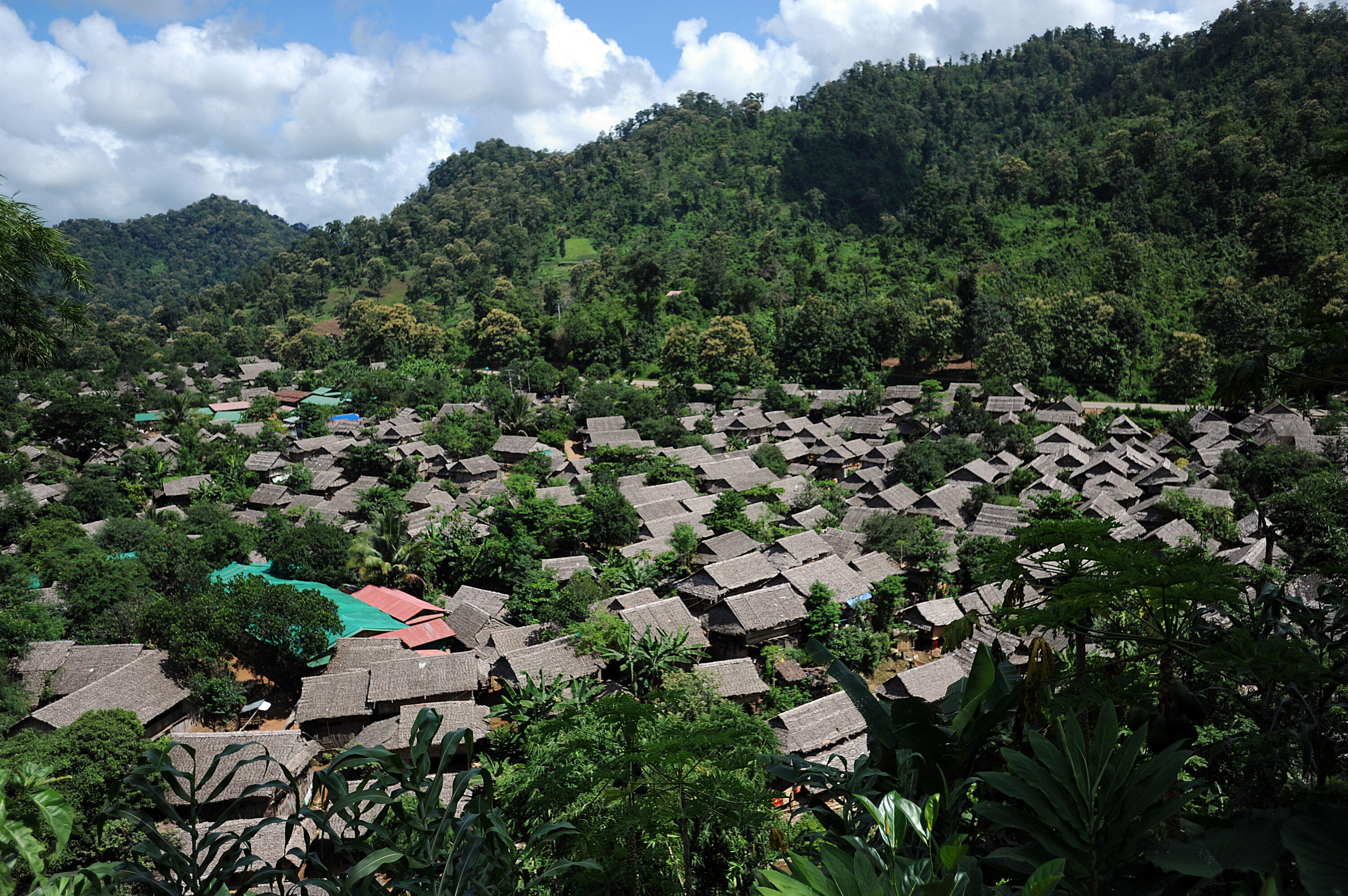An aerial view of Mae La refugee camp, nestled within jungle-covered hills in Thailand