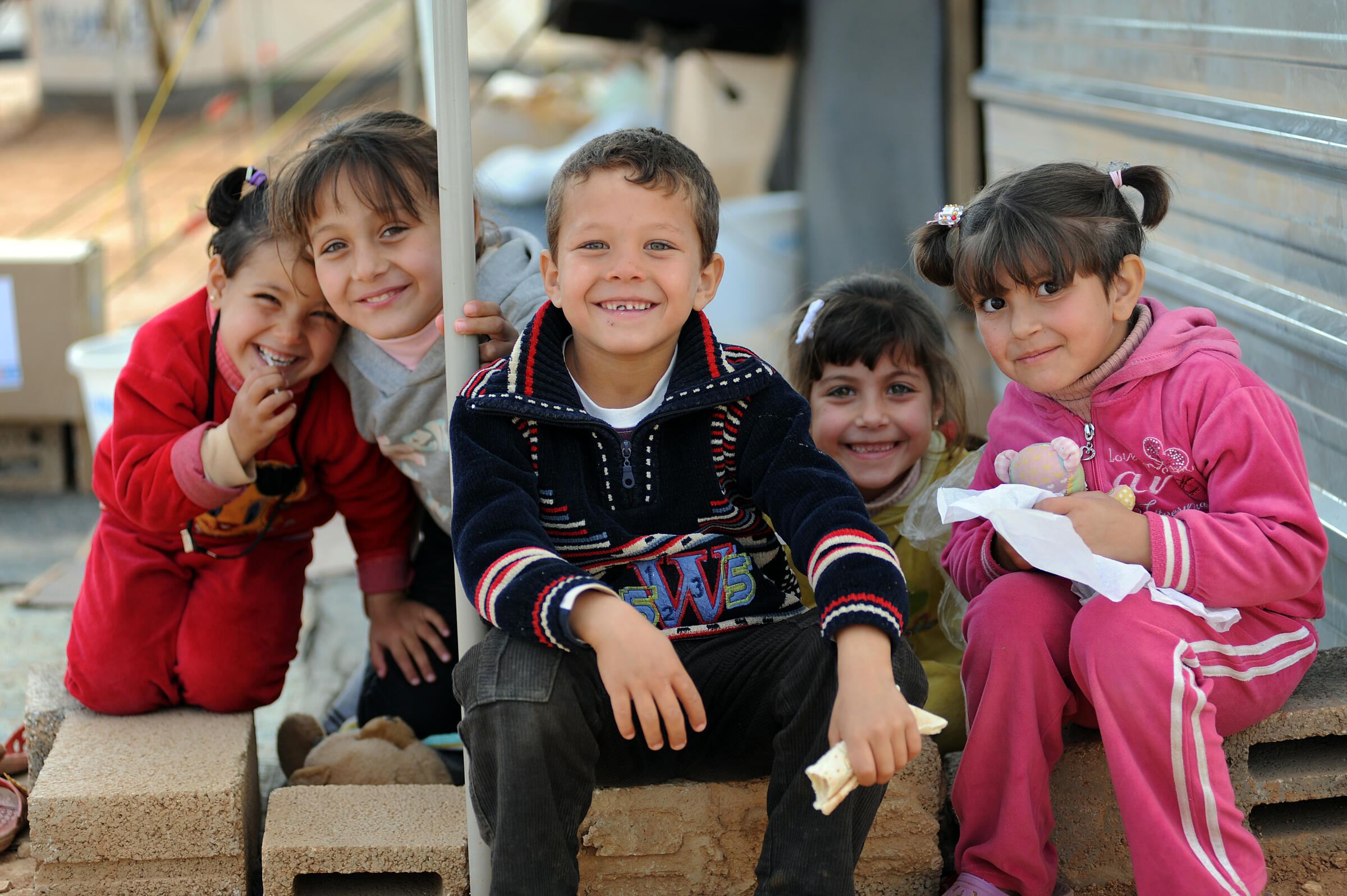 Osama, himself a refugee, volunteers with the IRC to support Syrian children who cross into Jordan without a parent or guardian.