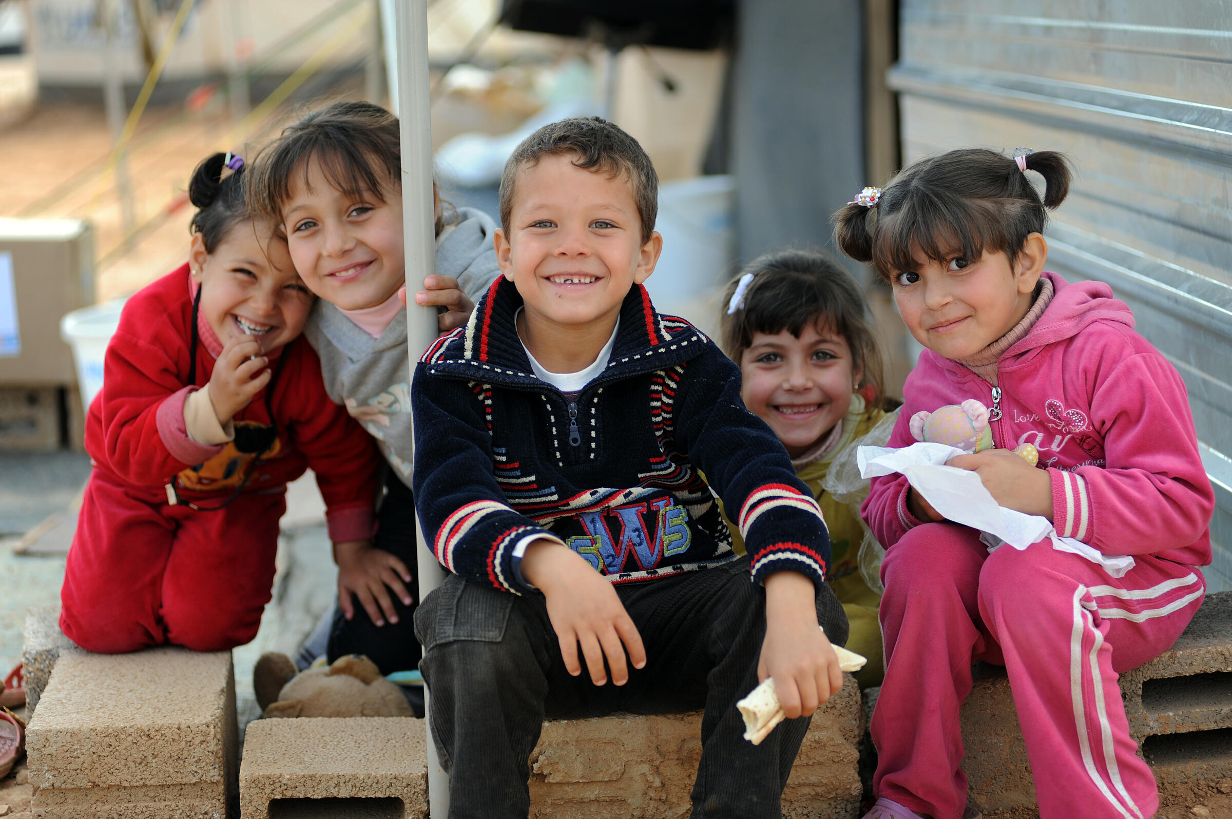 Osama, himself a refugee, volunteers with the IRC to support Syrian children who cross into Jordan without a parent or guardian. 