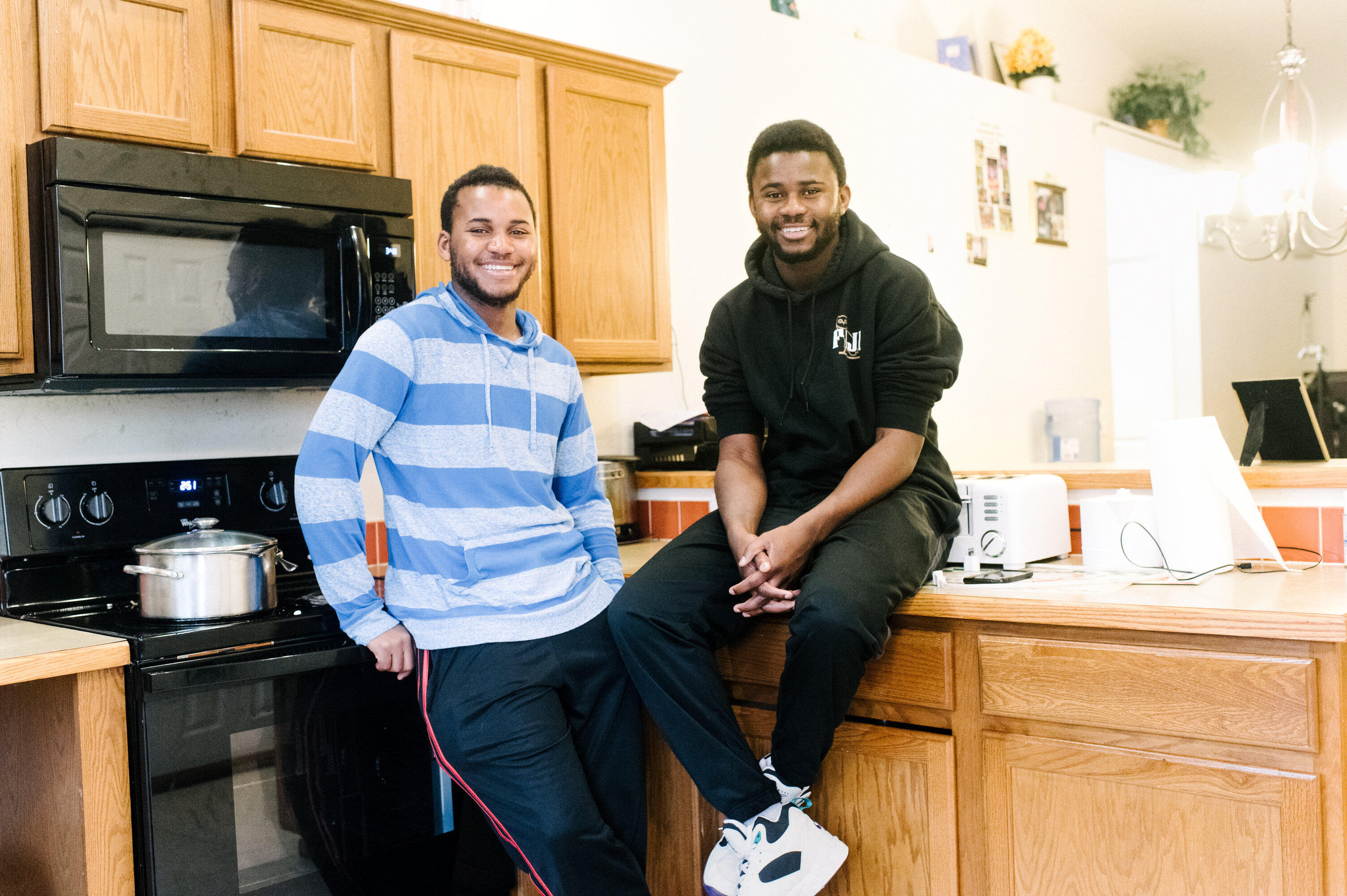 George and Patrick in their kitchen at home.