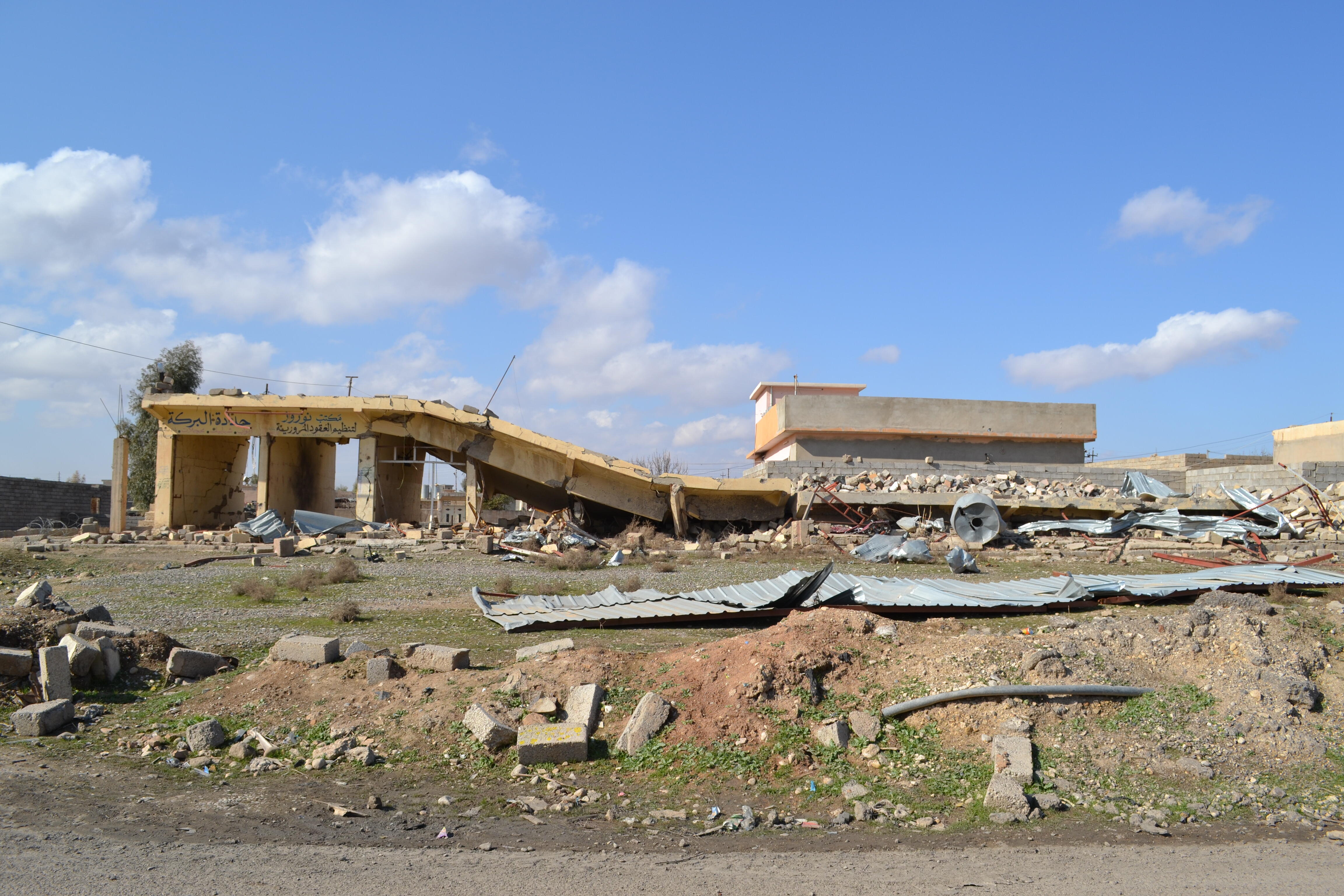 A collapsed row of shops, severely damaged by heavy fighting to retake the village of Baybokht from ISIS towards the beginning of battle for Mosul