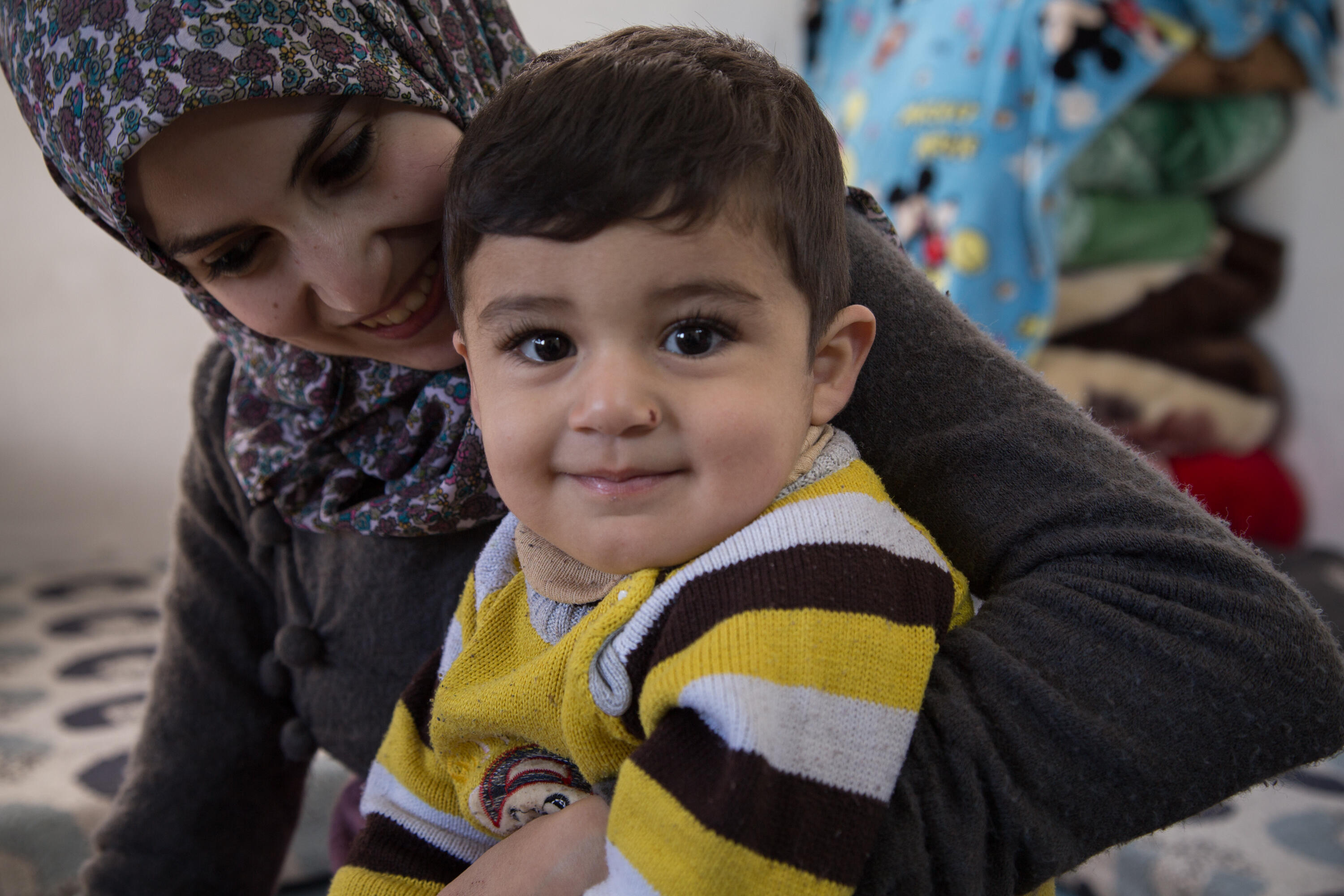 Two-year-old Khaled with his mother