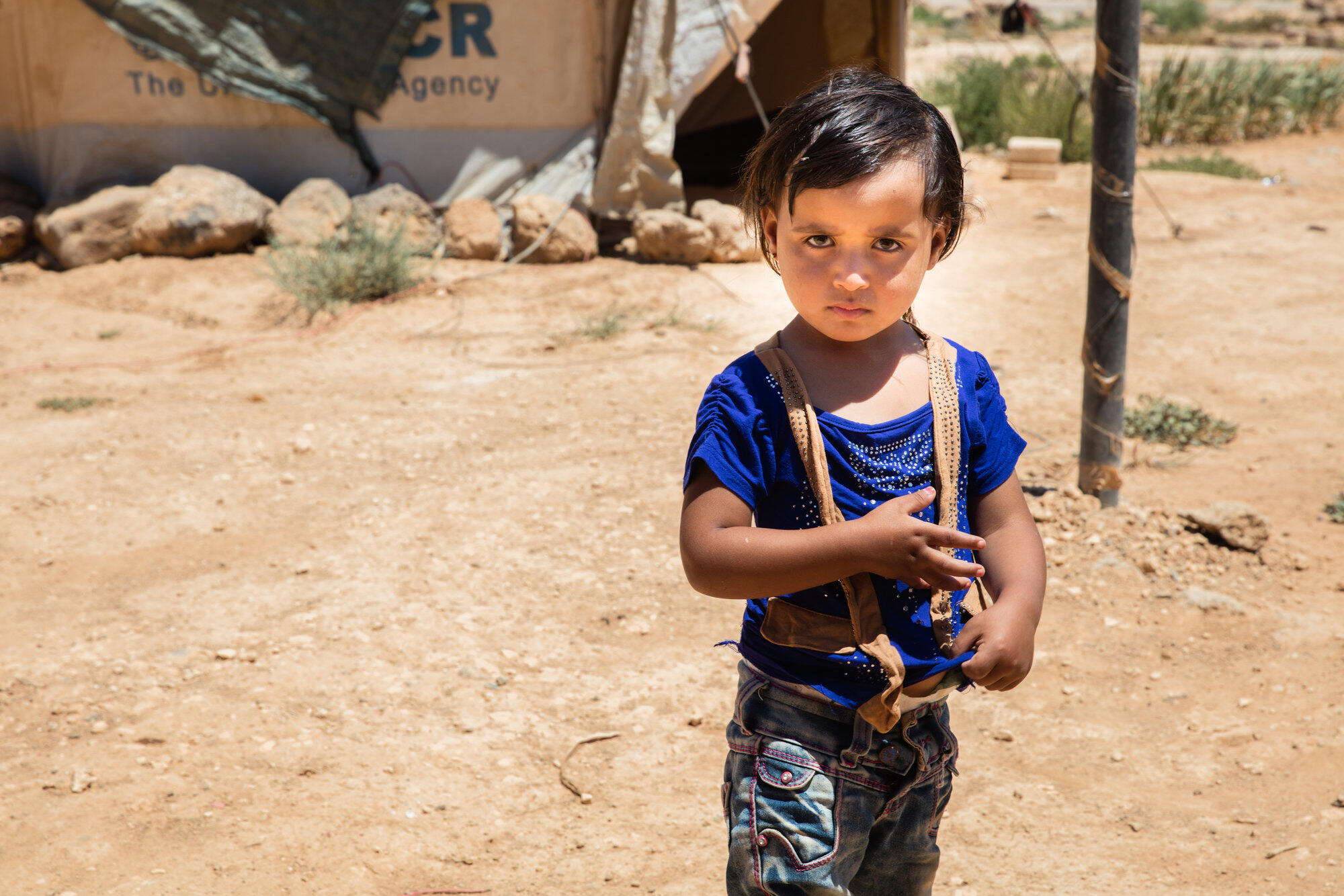 A young Syrian refugee in a refugee camp in Jordan