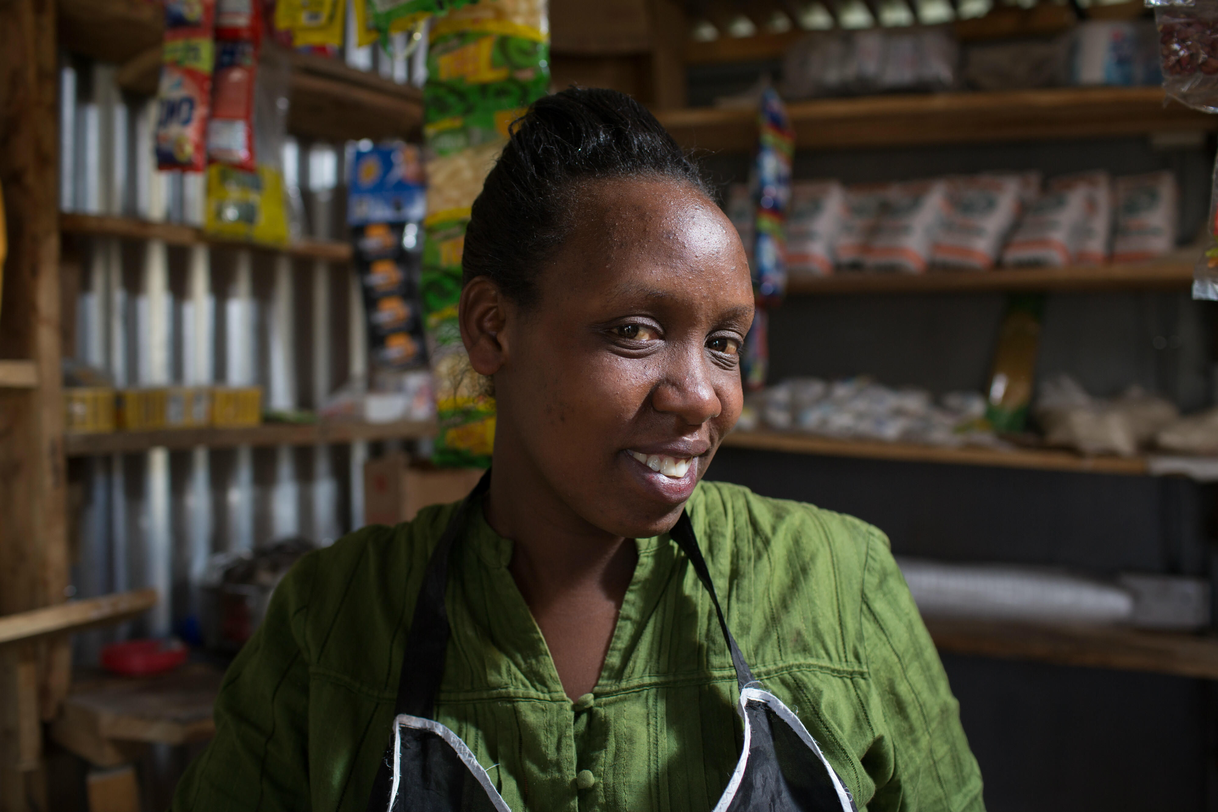 Chantal Rutonda Nyamuco inside the roadside stand where she sellsmandazi bread