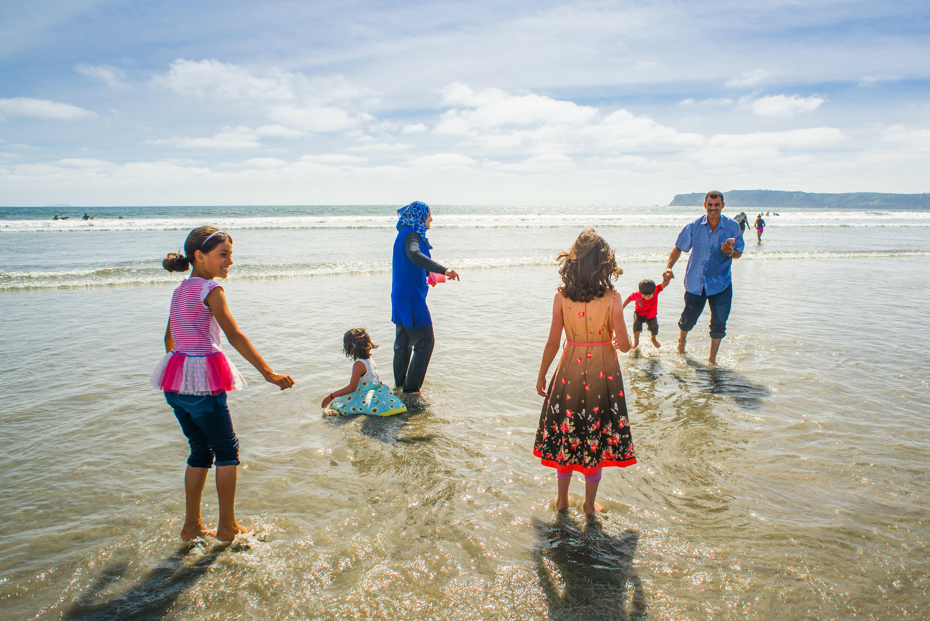 The Tlas family from Syria on a California  beach