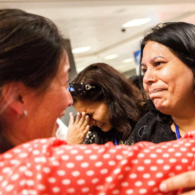 IRC staffer Kristin welcomes Shaista Sadiq at Dulles airport with a hug