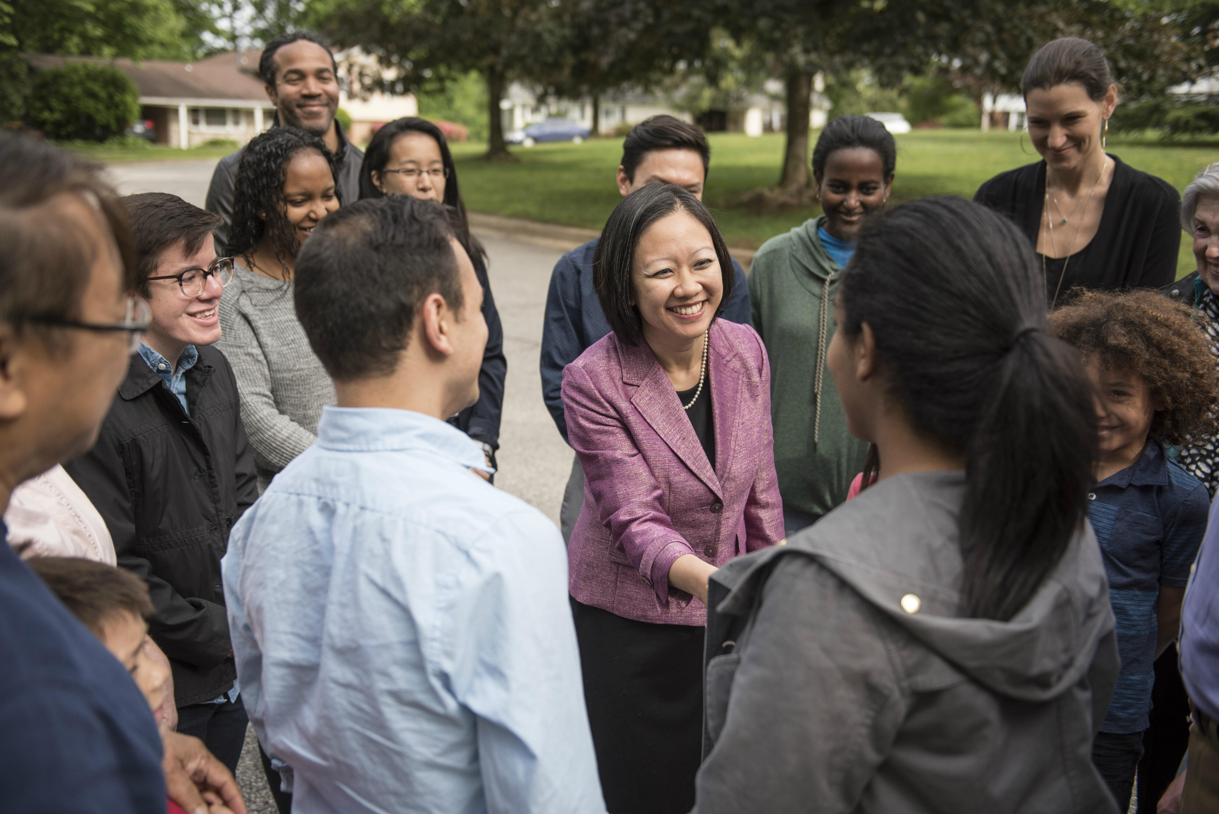 Kathy Tran shakes hands with voters in Virginia