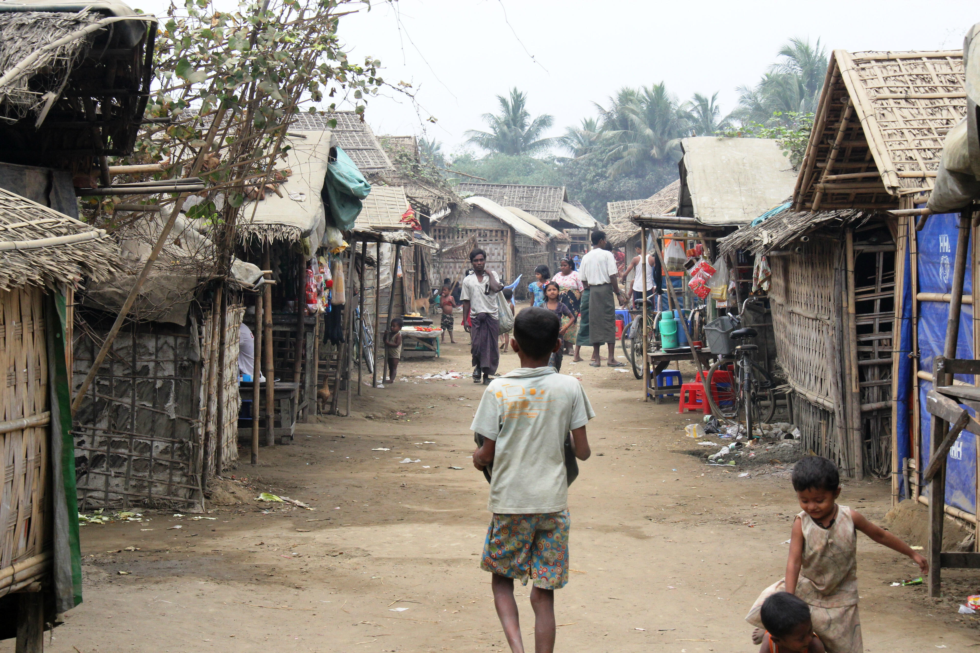 A boy walks through the streets of a crowded camp near Sittwe in Myanmar's Rakhine state.