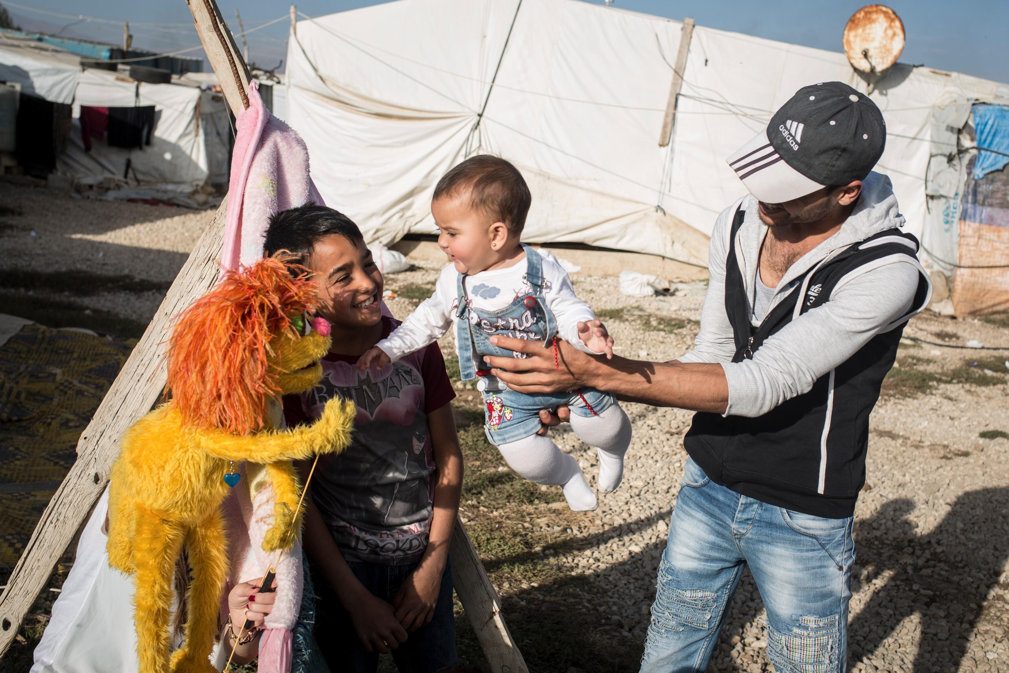 Sesame Street Muppet meets a Syrian family