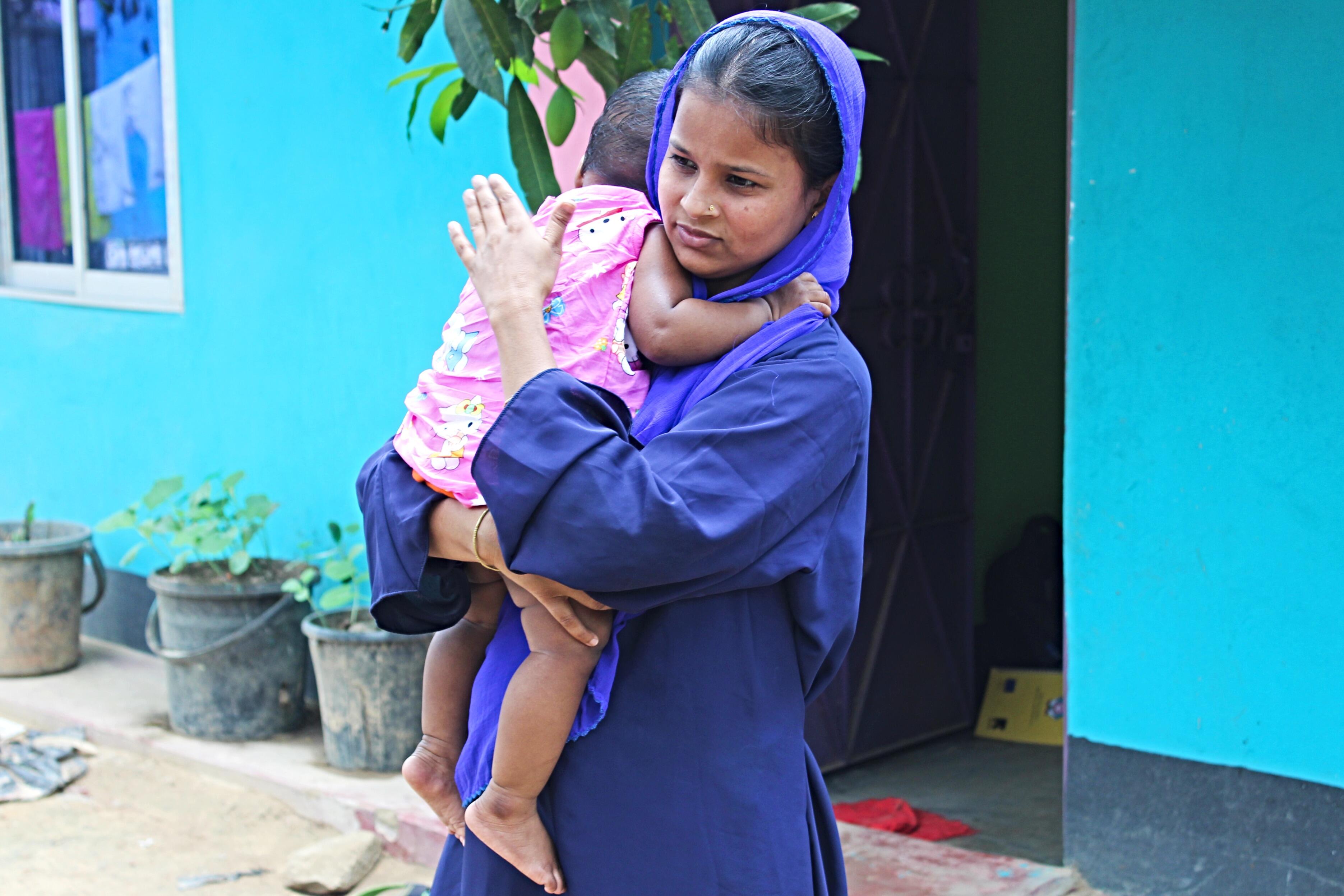 Lovely Akter with her nine-month-old daughter