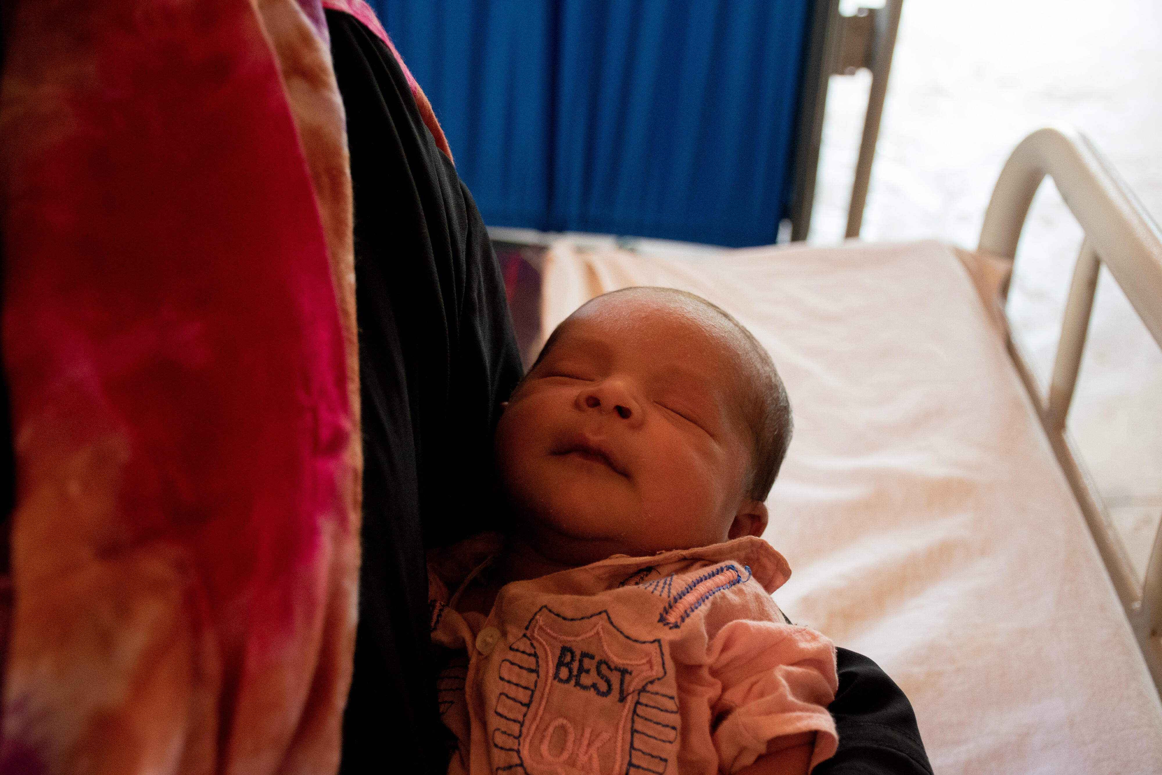 A four-day-old Rohingya boy in his mother's arms at an IRC health center in Bangladesh
