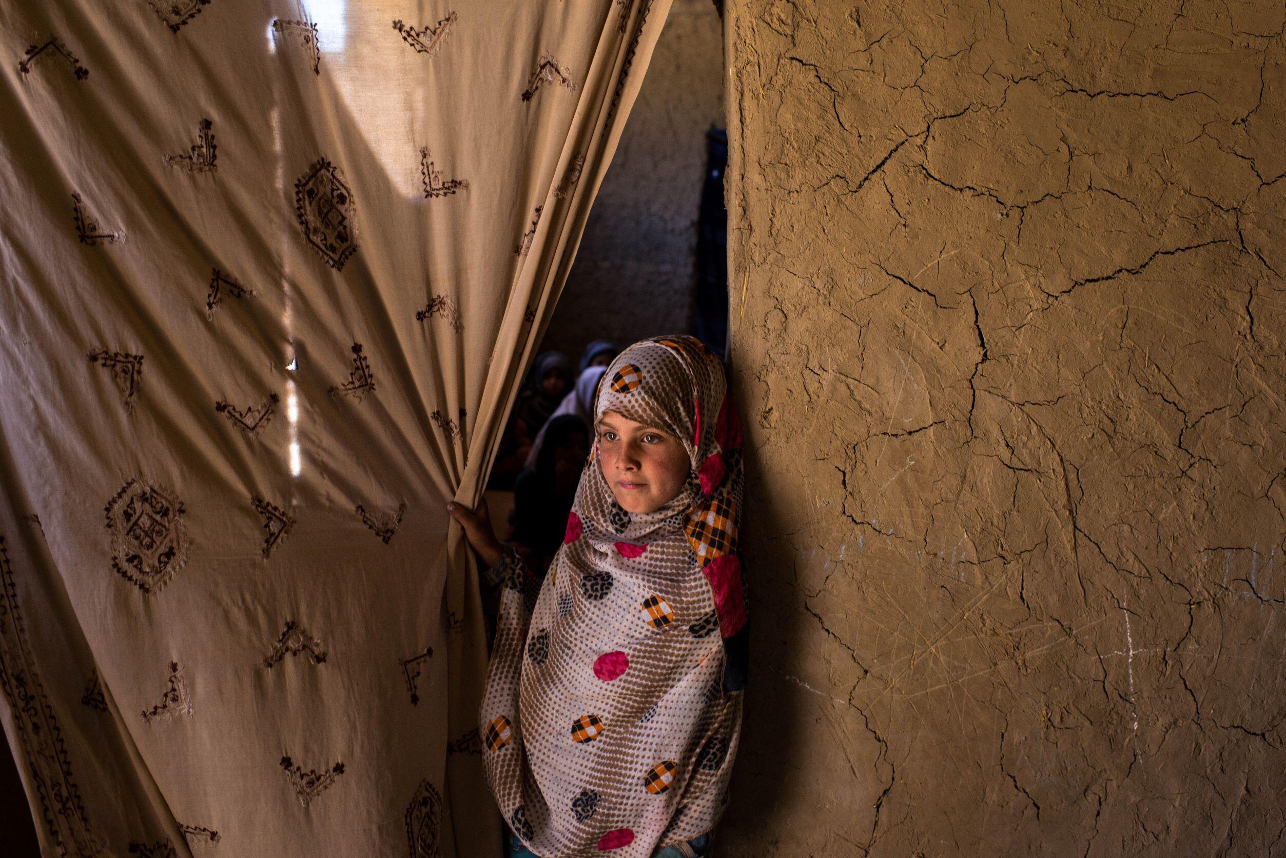 A young girl at the entrance to a classroom in eastern Kabul