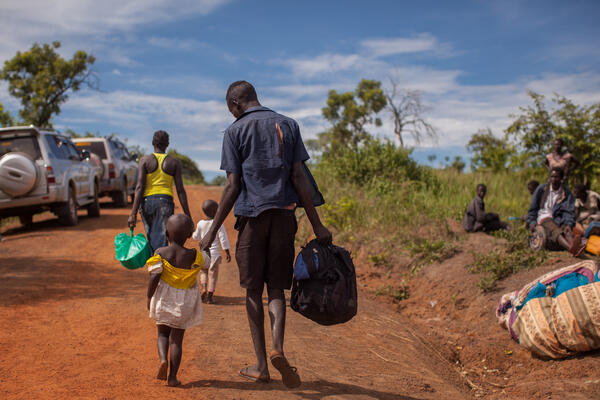 South Sudanese refugees cross the border from South Sudan to Uganda