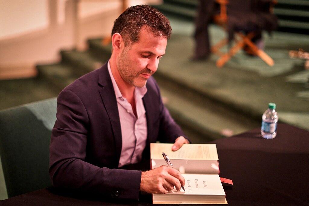 Khaled Hosseini signing a book