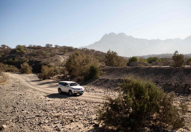 a car on a rocky track