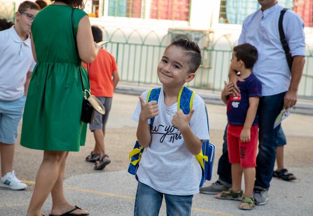 a young student smiling