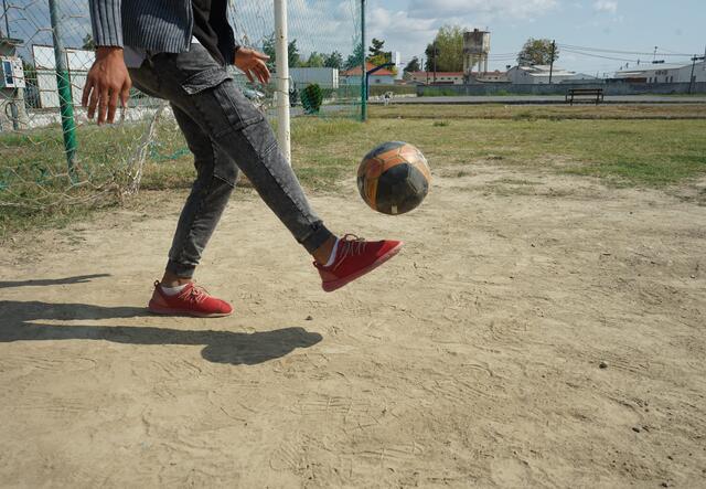 sami kicks a ball