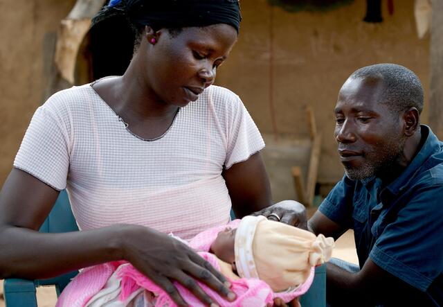 Yete and her husband Matthew with their newborn baby.