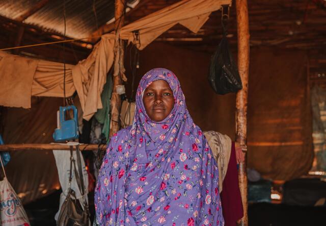A woman sits in her home in Ethiopia