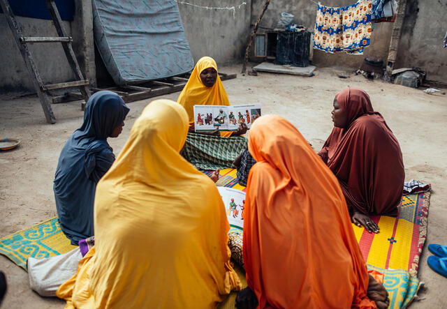 Hauwa Mustapha, 30, interacts with other women during mother-mother session within their community at Sulubri, Maiduguri, Borno, Nigeria