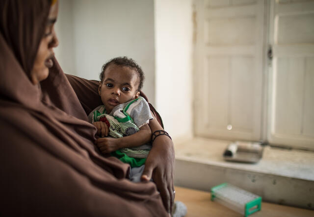 A mother smiles at her child in an IRC malnutrition centre in Somalia