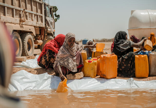 Bilan, 40, fetches water at Kambe Kebele. She says to have had ten cattle before the drought, but now only has one. "We used to rely on our cattle for income, but now we share food with our neighbors." Elele district, Somali Region.