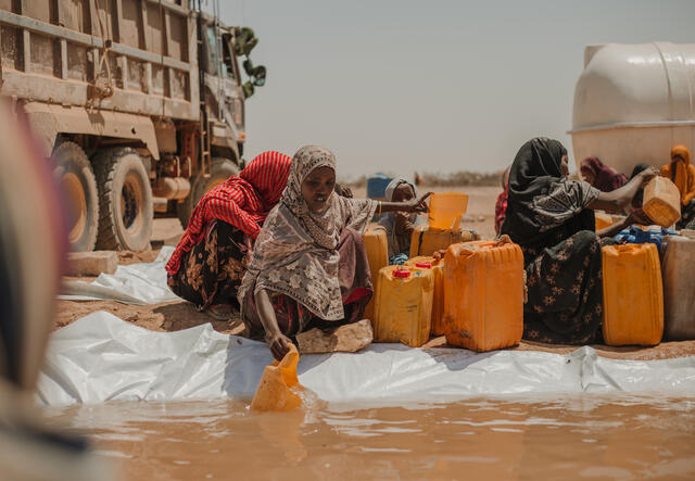 Bilan, 40, fetches water at Kambe Kebele. She says to have had ten cattle before the drought, but now only has one.