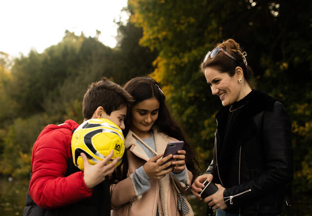 IRC client Zahra with her children in the park