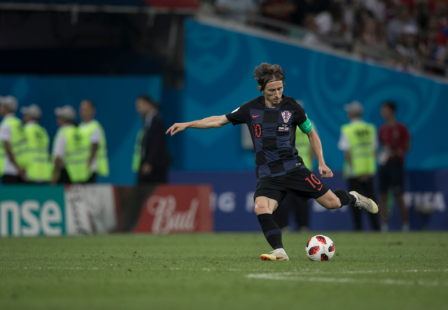 Luka Modric takes aim at goal during a match.